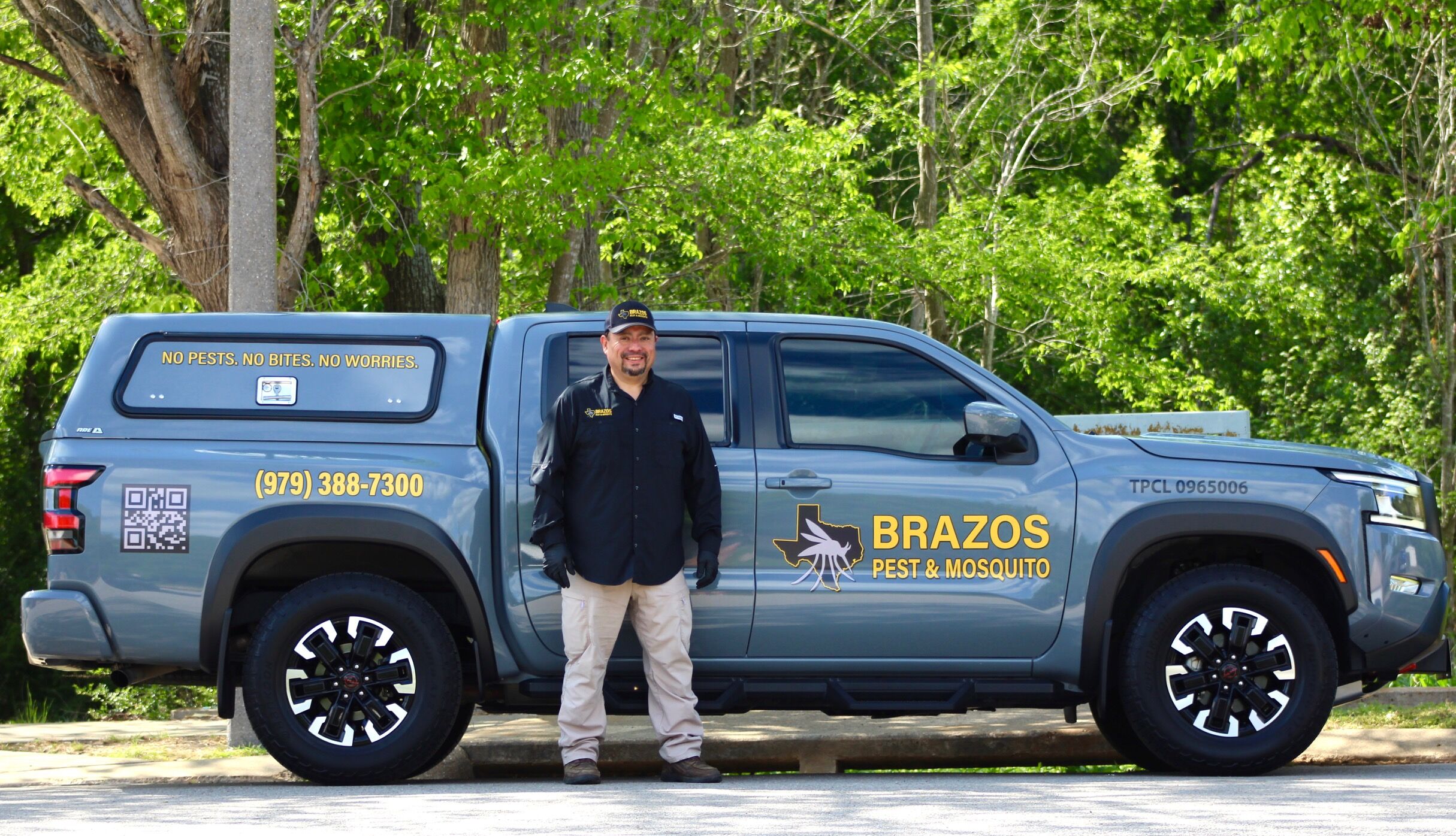 Professional pest control service in a lush green backyard